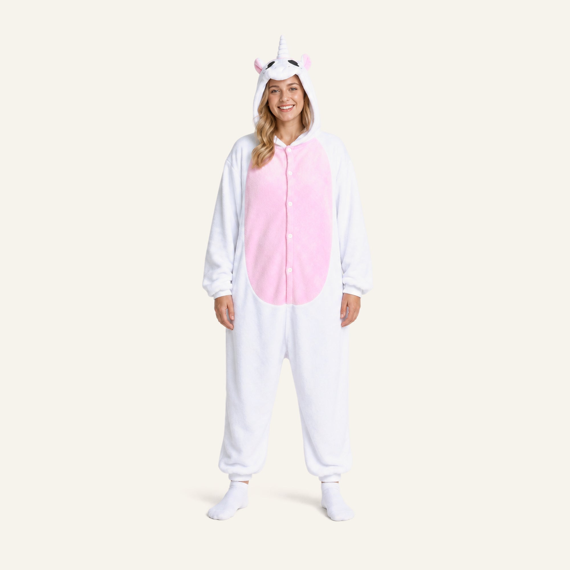 Adult woman wearing white unicorn onesie